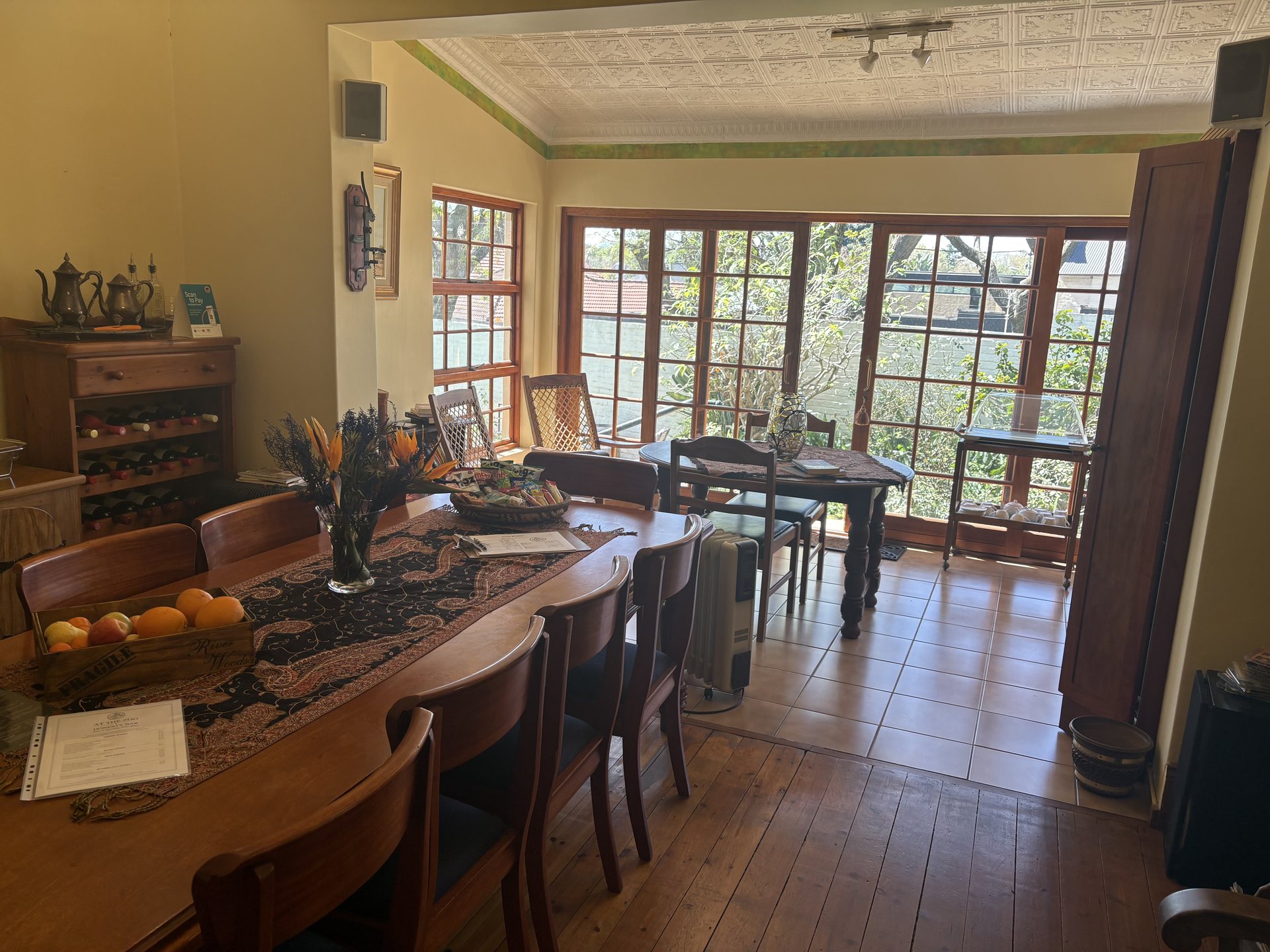 Garden Lounge at At The Zoo, with breakfast table and french doors to the garden